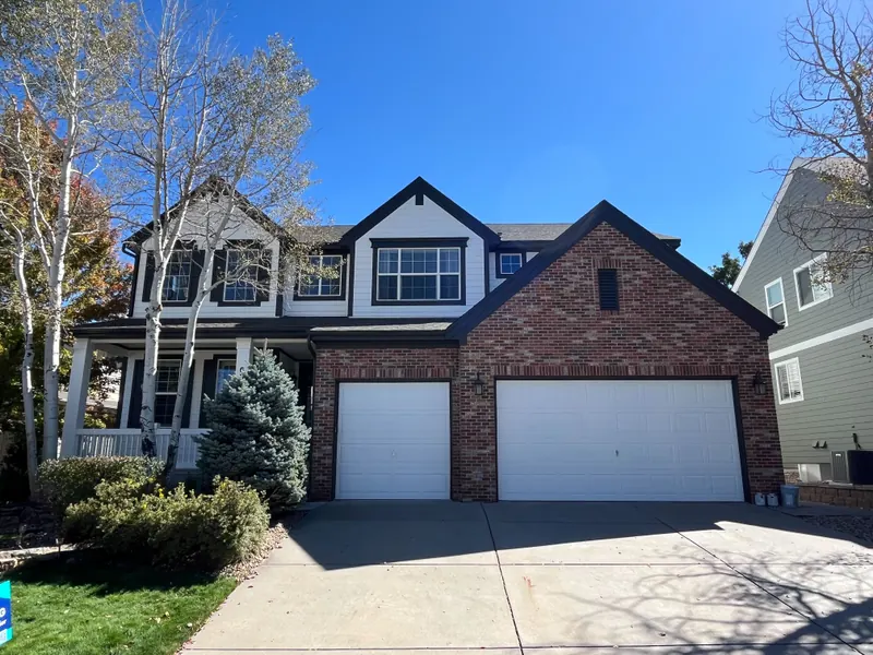 Repainted gray and brick two-story home in Littleton
